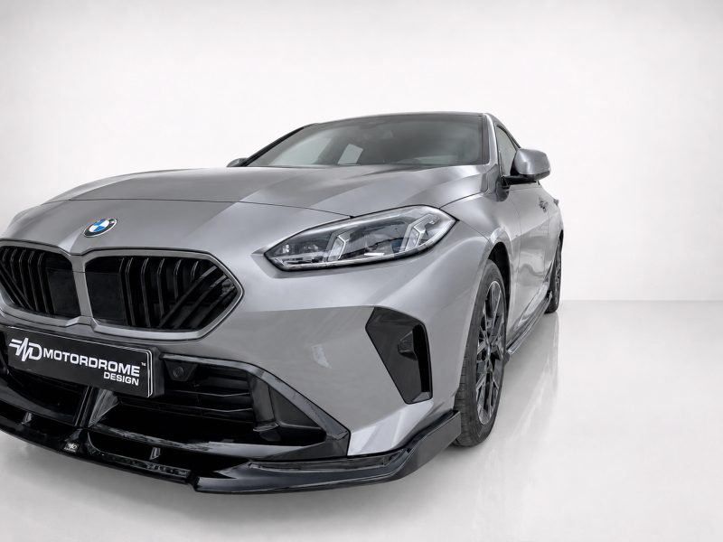 Front-left three-quarter view of a silver BMW in a white studio setting.