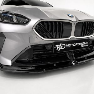 Close-up of a silver BMW-style front end with a bold black kidney grille and aggressive bumper features.