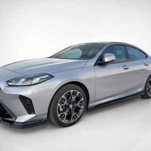 Front-left three-quarter view of a silver BMW sedan in a bright studio setting.