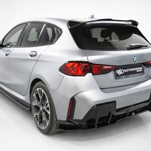 Rear three-quarter view of a silver BMW car in a white studio backdrop.