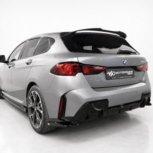 Rear-left view of a silver BMW hatchback with a sports rear bumper and large alloy wheels in a studio setting, no people present.