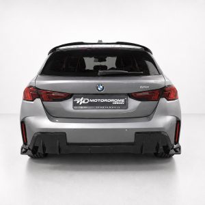 K215-006_4jpg - OPSHOLDERS Rear view of a silver BMW SUV with red taillights and a Motordrome Design plate visible on the license area.
