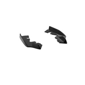 K215-006_5jpg - OPSHOLDERS Two glossy black plastic fragments separated on a white background, looking like broken pieces of a curved object.