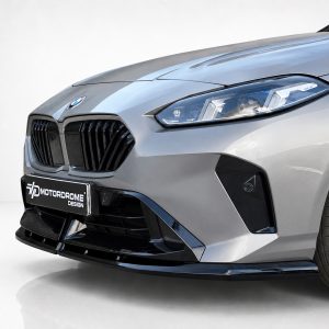 Front-left view of a silver BMW with prominent kidney grille, sleek LED headlight, and a Motordrome Design plate at the bumper