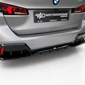 K215-008_3jpg - OPSHOLDERS Rear view of a silver BMW with a black Motordrome Design plate and sporty, aggressive bumper details