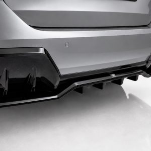K215-008_5jpg - OPSHOLDERS Rear view of a silver sports car showing an aggressive black diffuser and angular taillights on the bumper area. | Close-up of the car's rear bumper highlighting a glossy black diffuser and red taillight panel.