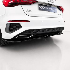 K216-003_2jpg - OPSHOLDERS Rear three-quarter view of a white Audi A3 SUV, showing taillights, badge, and hex-pattern rear diffuser with a dark bumper area