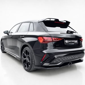 K216-005_2jpg - OPSHOLDERS Rear three-quarter view of a glossy black Audi SUV with a rear spoiler, red taillights, and large black wheels in a white studio setting.
