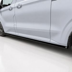 Side view of a light-gray van showing doors, wheel, and running board in a studio setting as a vehicle feature image.