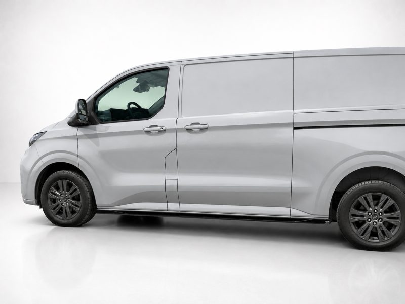 Side view of a silver cargo van with a sliding side door, shown in a studio setting.