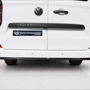 K217-006_4jpg - OPSHOLDERS Rear view of a white Volkswagen Transporter van with VW emblem and a MotorDrome Design badge on the left tail area.