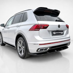 White Volkswagen Tiguan SUV shown from a rear-side angle in a clean studio setting