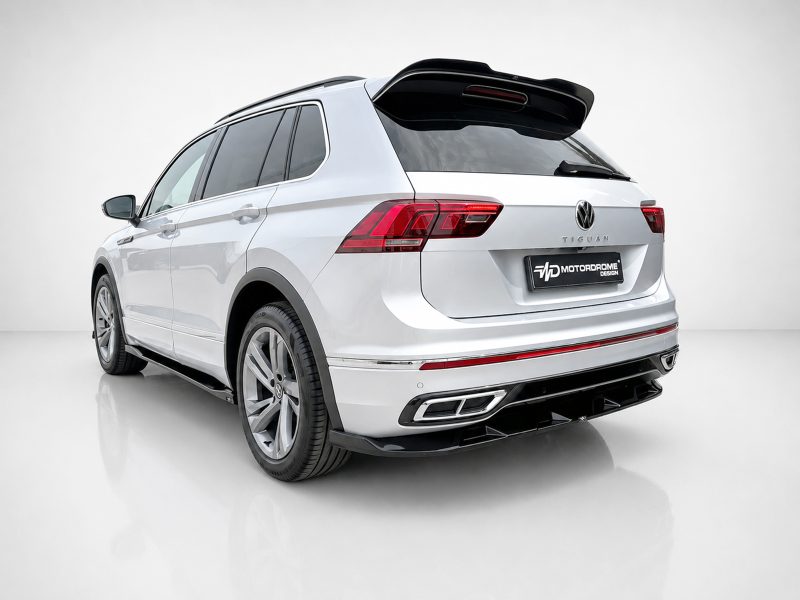 White Volkswagen Tiguan SUV shown from a rear-side angle in a clean studio setting