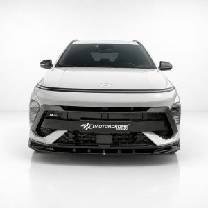 Front view of a white modern SUV with a black front grille, facing the camera, in a clean studio setting (Motordrome Design plate).
