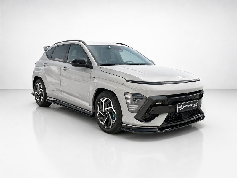 White compact SUV with black trim and large alloy wheels showcased in a bright studio setting.