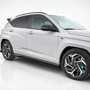 White SUV shown in a three-quarter front view in a studio with a clean gray background.