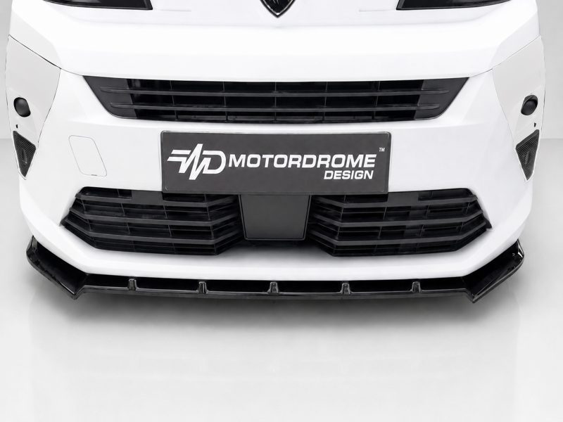 Front view of a white car with large black grille and a Motordrome Design plate in the center plate area