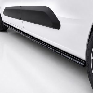 K222-004_2jpg - OPSHOLDERS Close-up of a white car's side showing a black side skirt and part of a wheel rim.