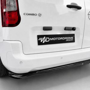 Rear of a white Opel Combo C van with a black Motordrome Design plate on the tailgate and an Opel badge visible on the right.