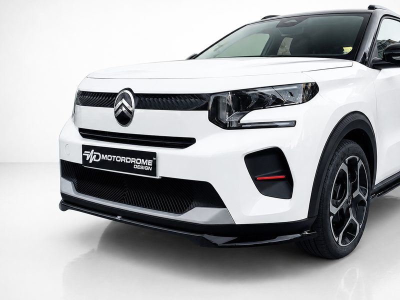 Front three-quarter view of a white SUV with a black grille and Citroën emblem on the hooded badge