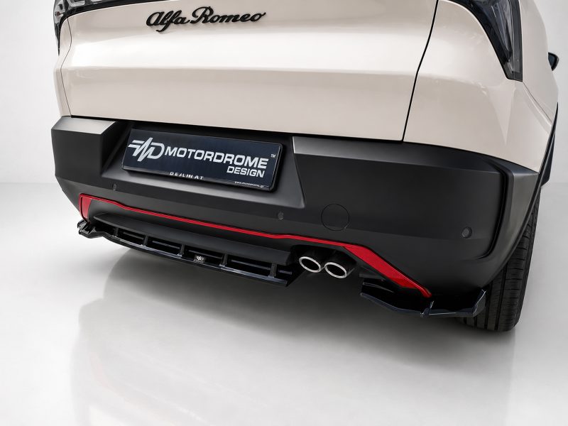 K227-003_3jpg - OPSHOLDERS Rear of a white Alfa Romeo with a MOTORDROME DESIGN plate and dual exhaust pipes at the bumper edge.