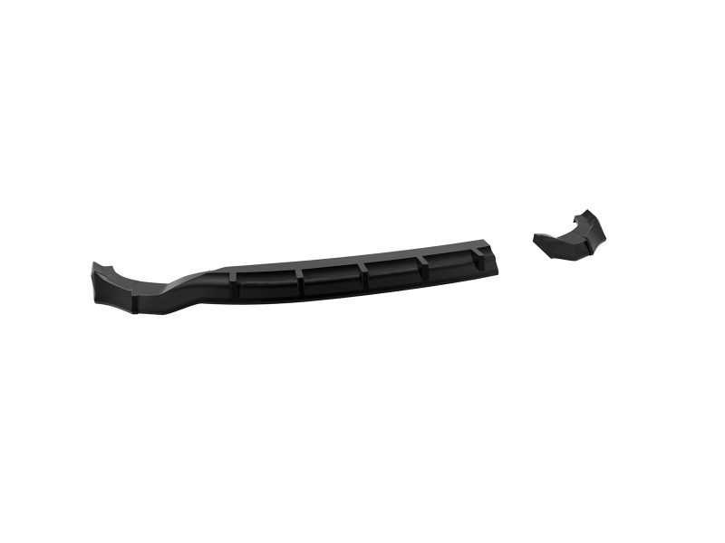 K227-003_5jpg - OPSHOLDERS Long, black plastic automotive part broken into two pieces, with a ribbed central section and curved ends (likely a bumper splash or diffuser piece).