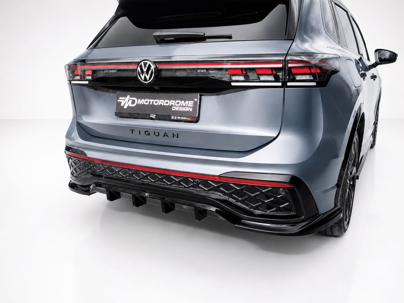 K228-003_4jpg - OPSHOLDERS Rear view of a silver Volkswagen Tiguan with prominent LED taillights and a MotorDrome Design plate