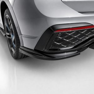 K228-004_4jpg - OPSHOLDERS Close-up of a silver car’s rear corner, showing the wheel, fender, and slim red taillight strip.