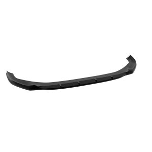 Long curved black car front lip spoiler lying on a white background, an aerodynamic splitter for a bumper