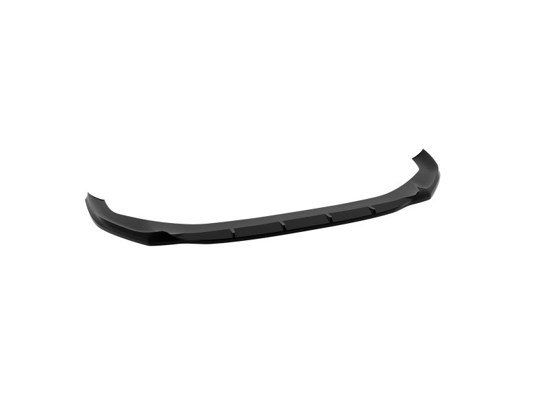 Long curved black car front lip spoiler lying on a white background, an aerodynamic splitter for a bumper