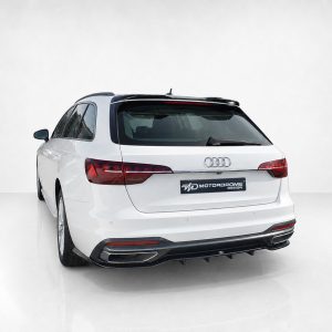 Rear view of a white Audi SUV in a bright studio setting, showing the MotorDrome Design badge on the tailgate.