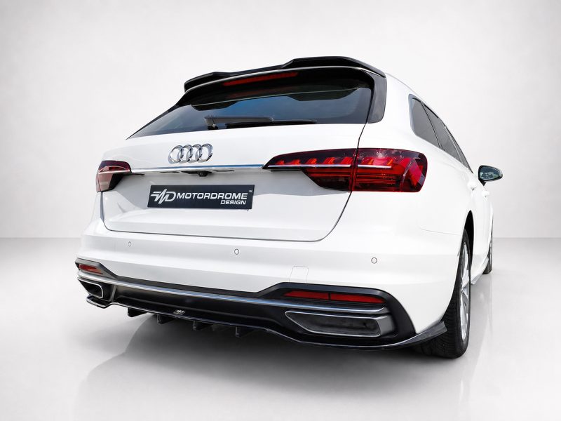White Audi SUV rear view in a studio, showing the Motordrome Design license plate and sleek taillights