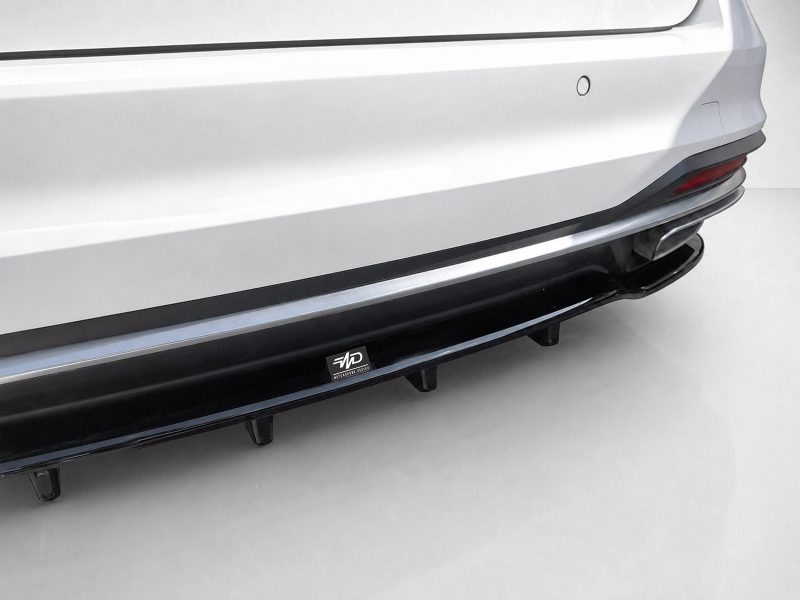 Close-up of a white SUV rear bumper with a black side skirt/step rail and a small MD badge sticker underneath