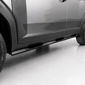 Side view of a gray SUV, showing the wheels and sculpted lower side skirt.