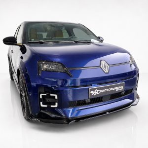 Front three-quarter view of a blue Renault car in a white studio, showing the diamond badge on the hood.