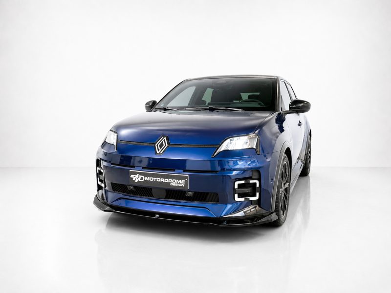 Front three-quarter view of a blue Renault compact car with a diamond logo, in a white studio setting.
