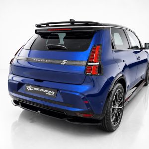 Blue Renault SUV shown from the rear-left side in a bright studio, featuring prominent taillights, spoiler, and a glossy finish; a MOTORDROME DESIGN plate is visible on the bumper.
