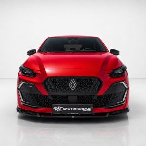 Front view of a bright red car with a bold honeycomb grille and Renault logo in a studio setting.