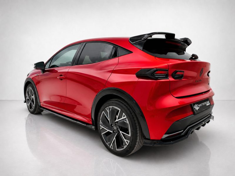 K233-002_4jpg - OPSHOLDERS Red sporty crossover car shown from the rear-three-quarter angle in a studio, with large black alloy wheels and glossy finish.