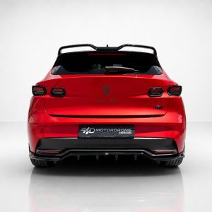 Rear view of a bright red Renault Clio hatchback with dark taillights and a black rear spoiler in a studio setting