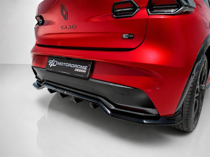 Rear view of a red car showing the Clio badge, E-Tech Hybrid emblem, and a black Motorodrome Design plate.