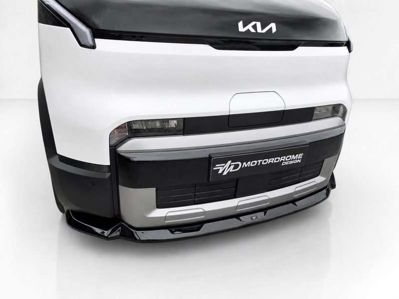 Front view of a white truck with a black upper hood and custom lower bumper, logo visible on the hood (Kia).