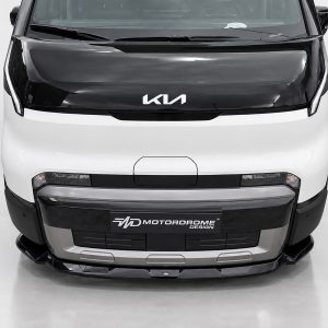 Front view of a white Kia van with black hood, displaying the Kia logo and Motordrome Design license plate area