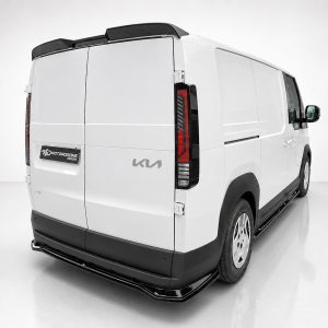 White cargo van viewed from rear-left, with black bumper and roof rails, branding on rear door and side badge visible