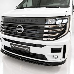 Front view of a white Nissan Interstar van, highlighting the bold grille and logo.