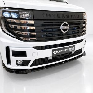 Front view of a white Nissan Interstar truck with a black grille and chrome accents, headlights visible at left