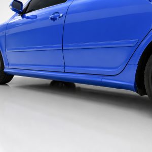 Blue sport car side view focusing on the door area, lower side skirt, and alloy wheel with red brake calipers on a white floor.