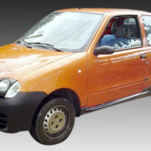 Orange compact car photographed from the front-left side on a gray gradient background from dark to light.