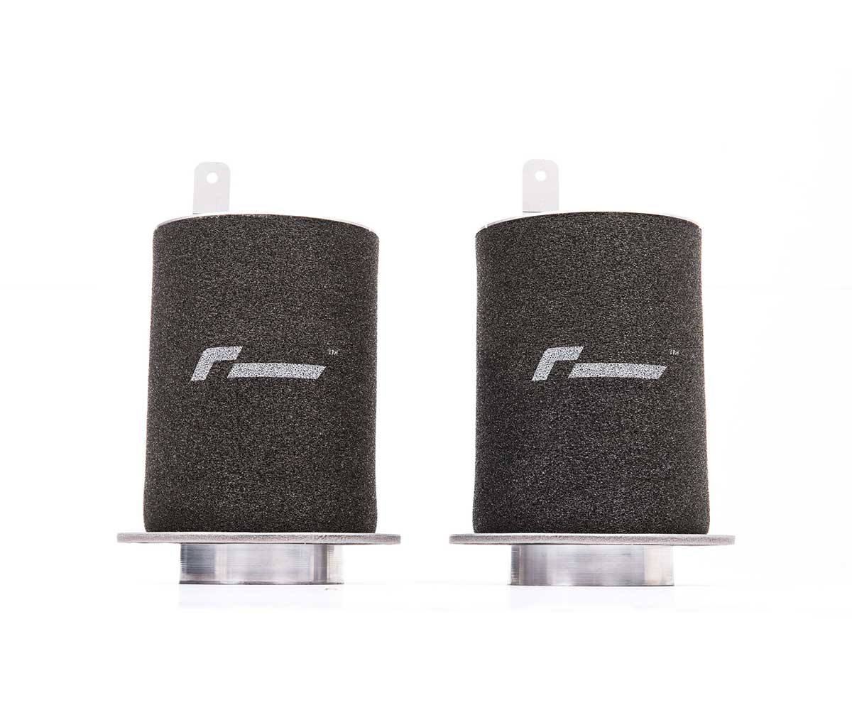 R8_52_Filterjpg - OPSHOLDERS Pair of black cylindrical foam air filters with metal bases, likely for an air intake system (cars or motorcycles).
