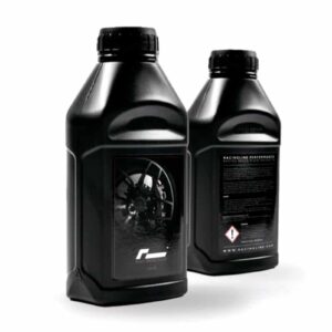 Two black motor oil bottles with screw caps, one facing forward showing a wheel on the label and the other showing back label text.